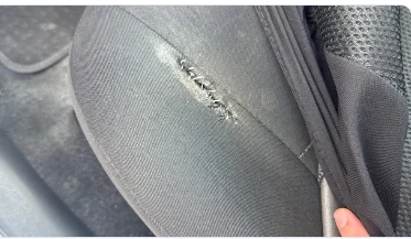 Driver seat lower outer bolster with a tear detected by AI